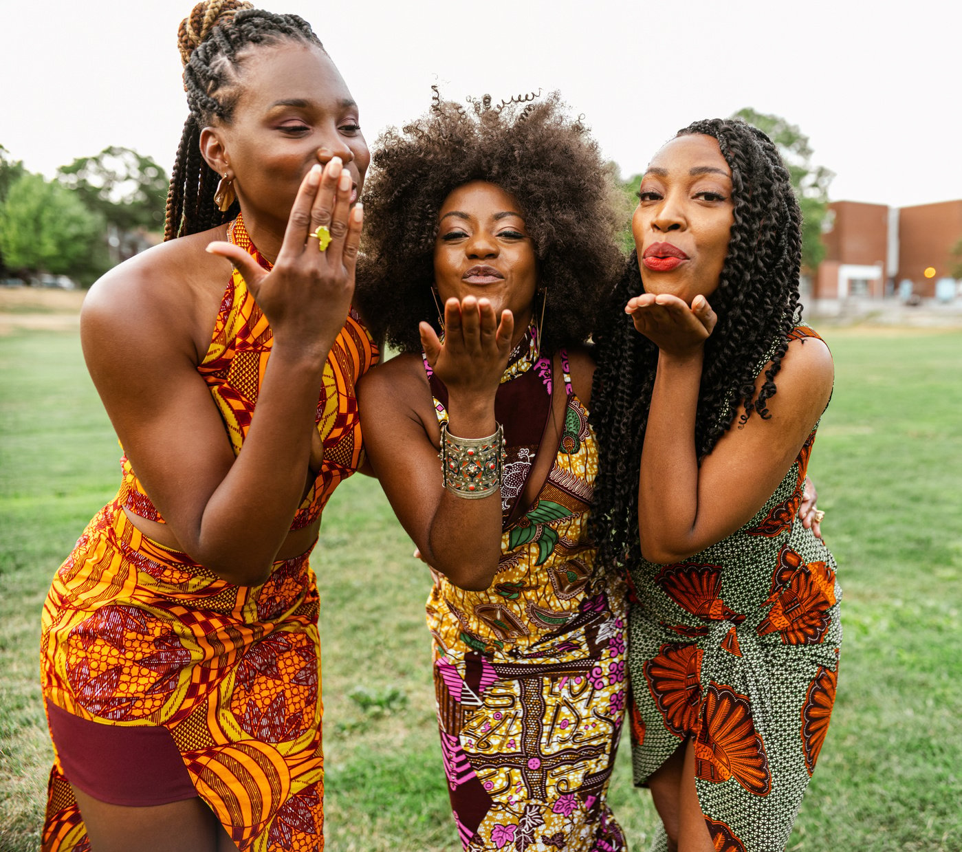 3 Young black women walking the field